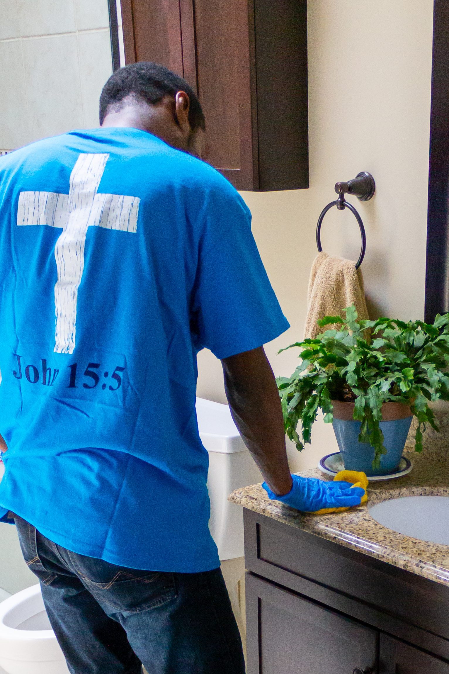 A cleaner cleaning a restroom.